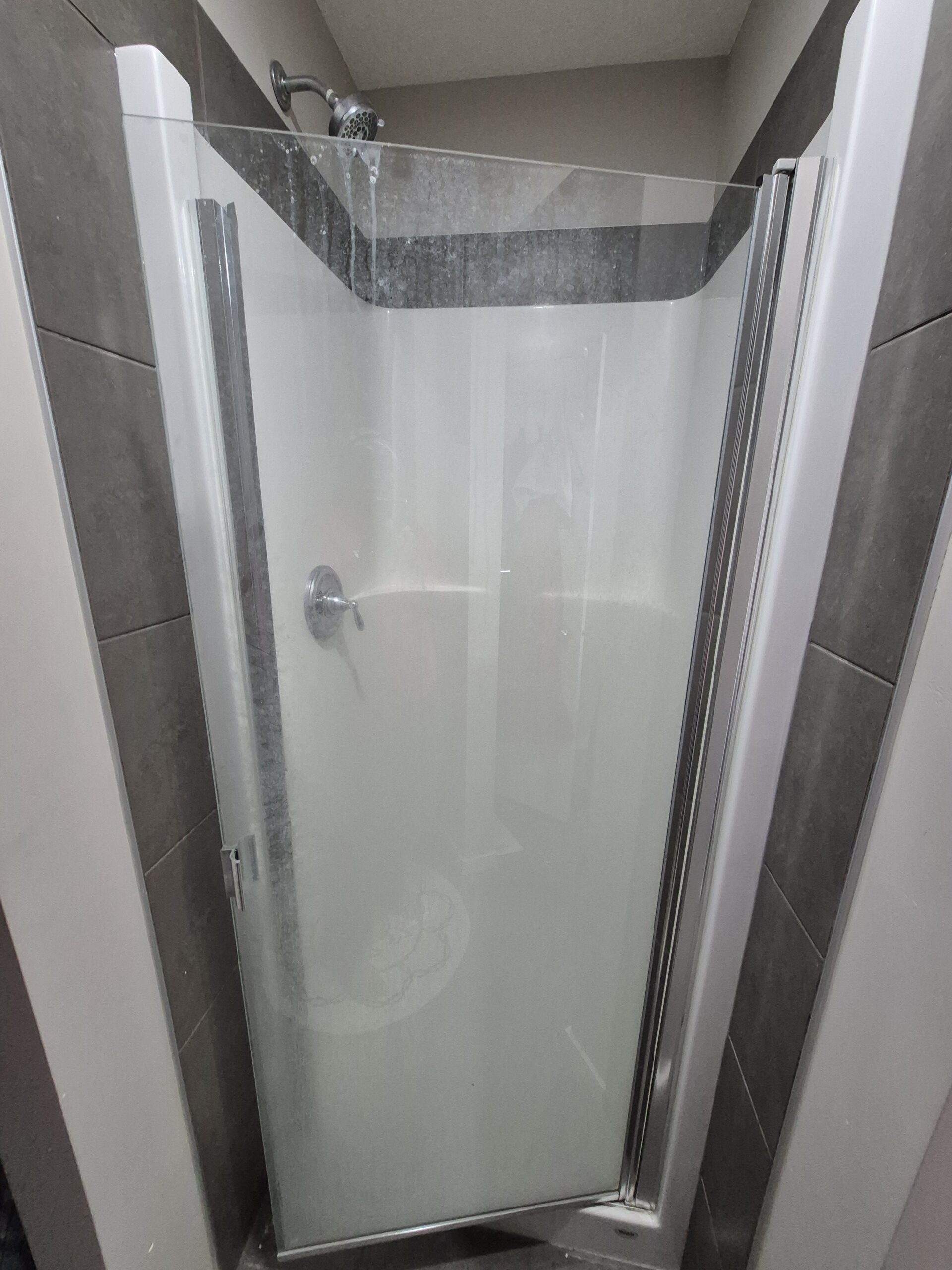 Before: cloudy shower glass